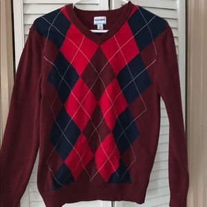 Maroon patterned sweater.